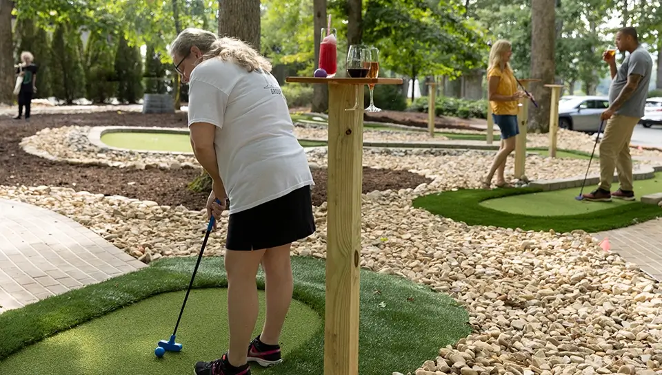 Putting a golf ball and sipping wine go hand-in-hand on the Keswick Vineyards mini golf course