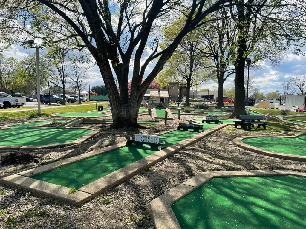 AGS restored East Potomac mini golf course with historic obstacles and rebuilt well rooftop-with-owl