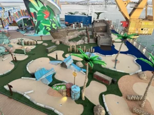 At drydock, theme elements are seen after being lowered into place on the faux sand mini-golf course